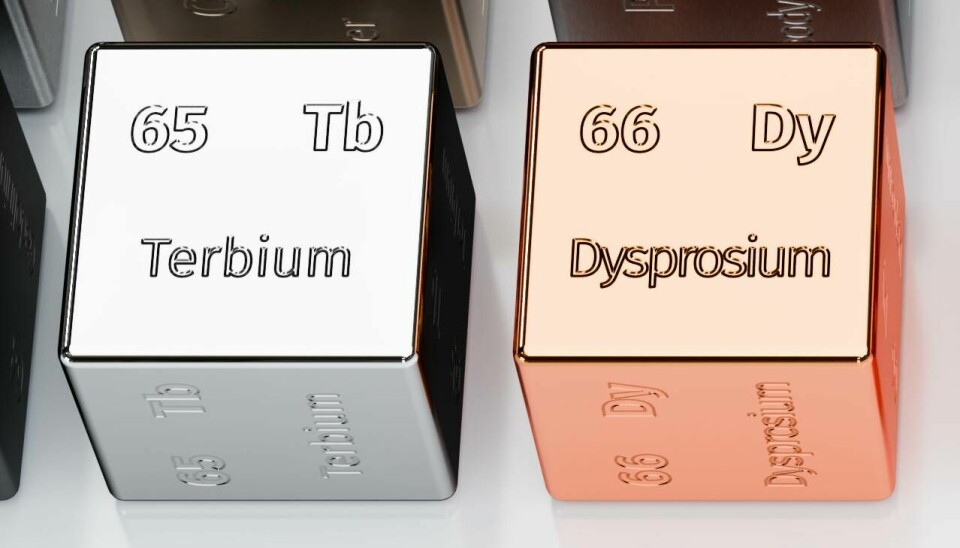 Cubos metálicos con los símbolos químicos del terbio y el disprosio, representando tierras raras utilizadas en tecnología e industria.